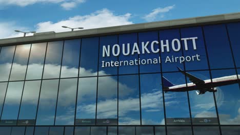 airplane landing at nouakchott mauritania airport mirrored in terminal