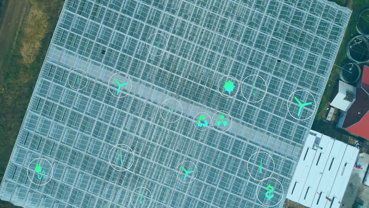 Digital icons overlaying agricultural technology concepts in aerial view of greenhouse