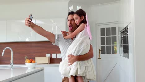 Father-and-masked-girl-taking-selfie