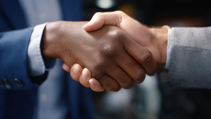 A Firm Handshake Symbolizing Trust and Partnership Between Two Individuals in a Professional Environment, Showcasing Commitment and Collaboration for Success