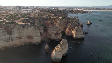 Aerial-view-of-Ponta-da-Piedade-rock-formations-in-Lagos,-Portugal