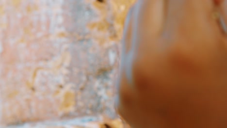 Slow-motion-close-up-of-somebody-rolling-a-cannabis-joint-outside-in-the-Caribbean