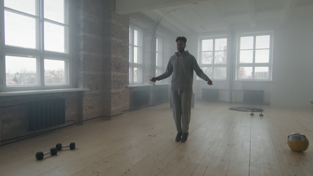 African American Sportsman Jumping Rope Indoors