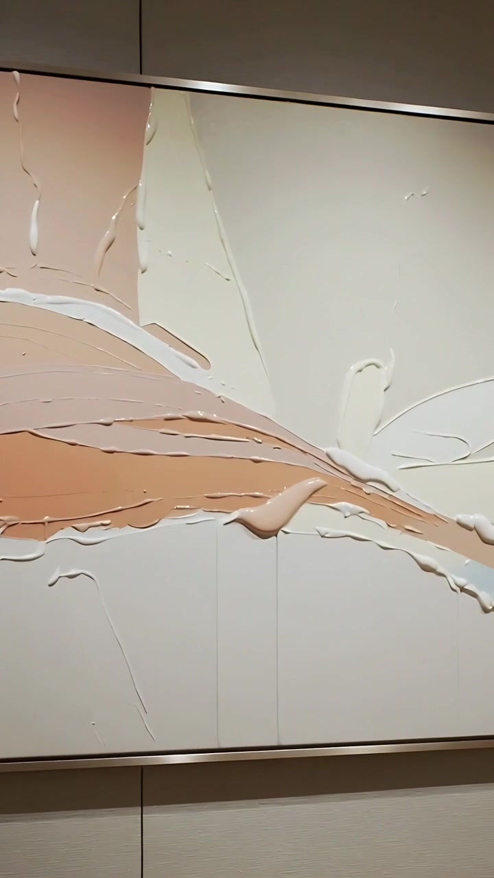 Vertical video: Panning camera starting close revealing painting on hall wall showing impasto