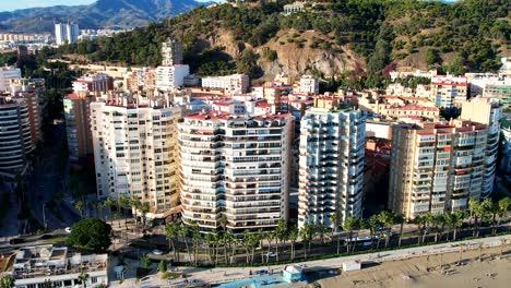 Aerial,-Beachside-view-The-coast-of-Playa-de-la-Caleta-in-Malaga