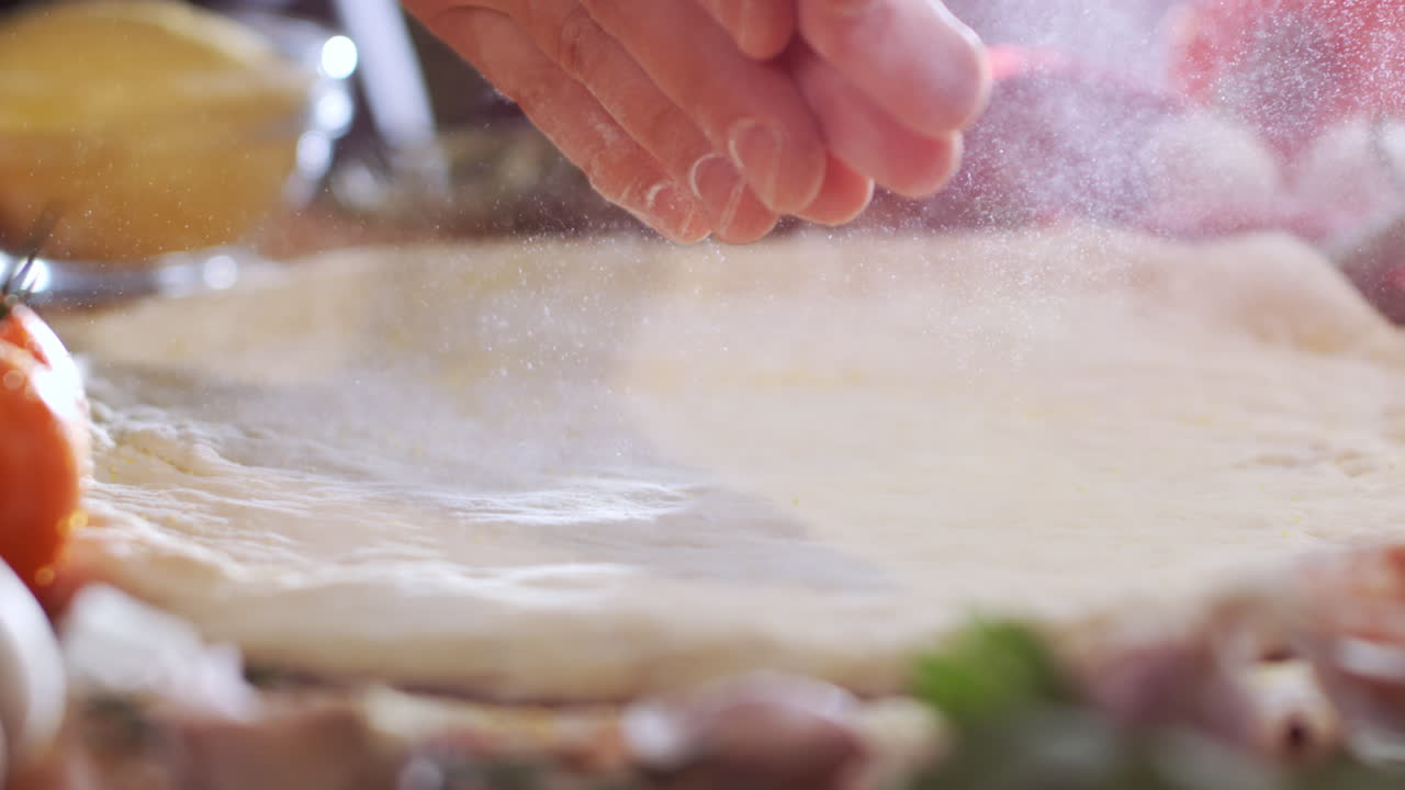 Preparing Pizza Dough with Flour and Fresh Ingredients