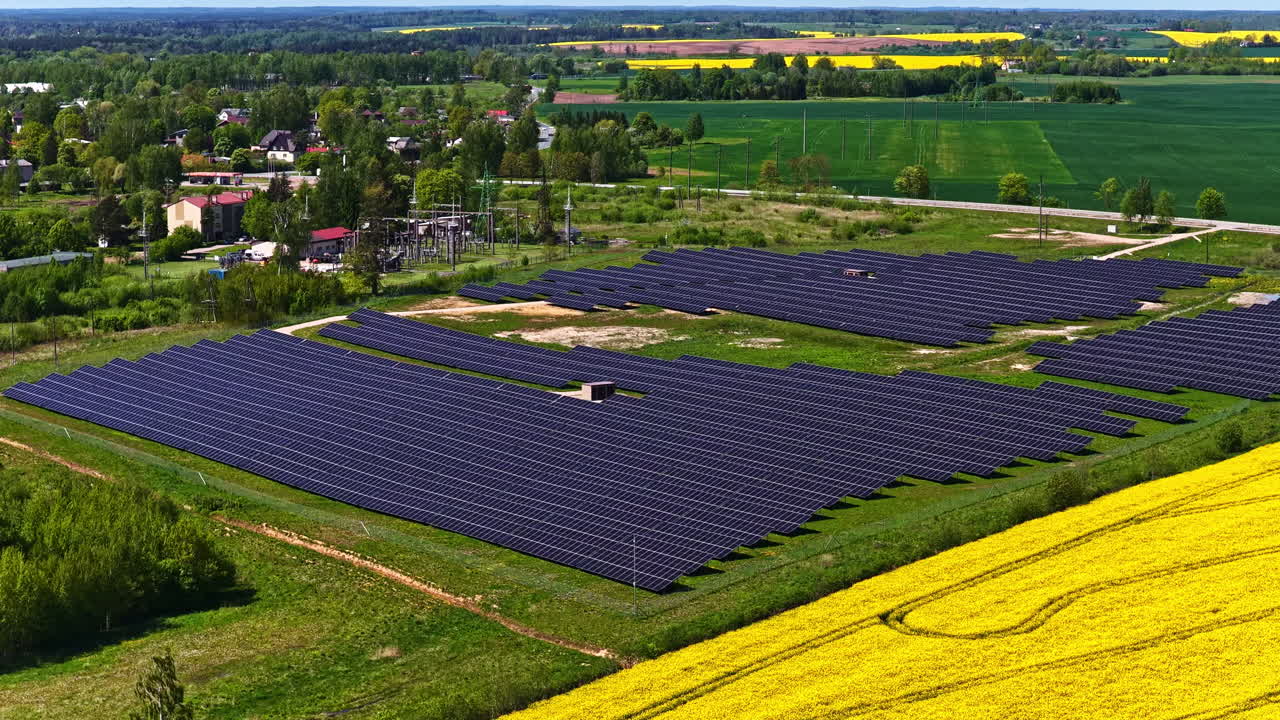 Green energy environmentally friendly renewable solar panel electricity farm field, aerial