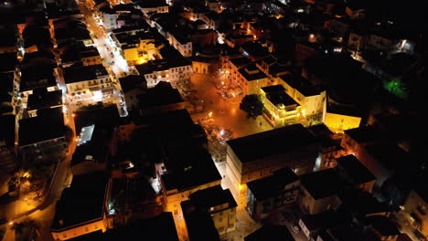 Drone-flight-over-Nafplio,-Greece-at-night