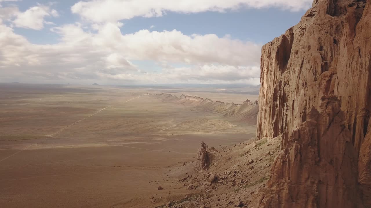 drone shot flying close by looking over the beautiful landscape around Shiprock, Navajo New Mexico USA in 4k