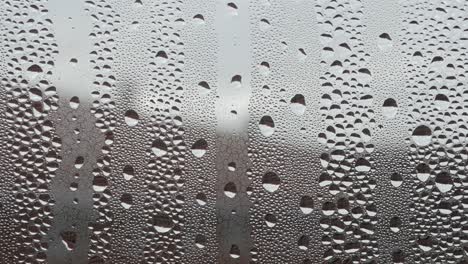 water droplets on foggy window glass, background