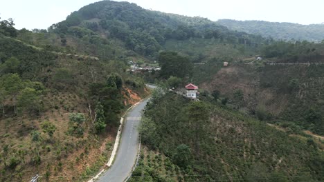 mountain road with winding highway and lush green hills