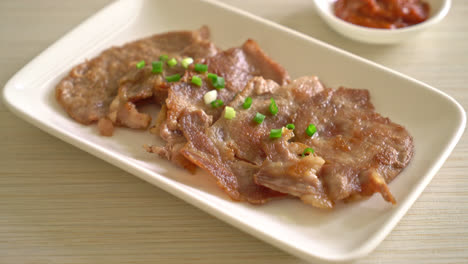 grilled-pork-neck-sliced-on-plate-in-Asian-style