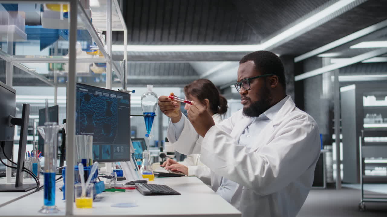 Vertical video Quality control analyst in lab testing blood sample using computer