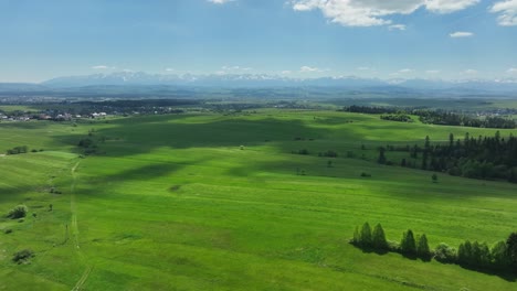 polish mountainside tranquil scenery, tatra mountain against sunlit ethereal sky aerial