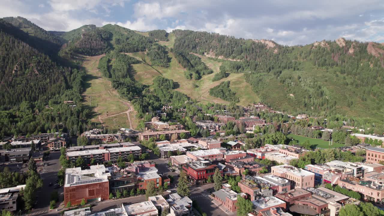 Aerial view of Aspen Village with Aspen Mountain and Resort in background, 4K drone footage