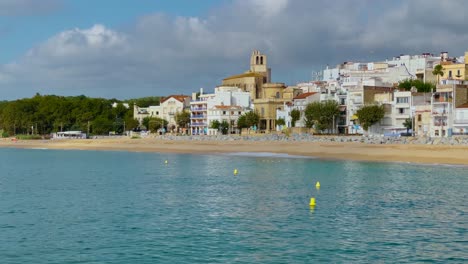 Platja-de-les-Barques-sea-field-Maresme-Barcelona-Mediterranean-coast-plane-close-to-turquoise-blue-transparent-water-beach-without-people