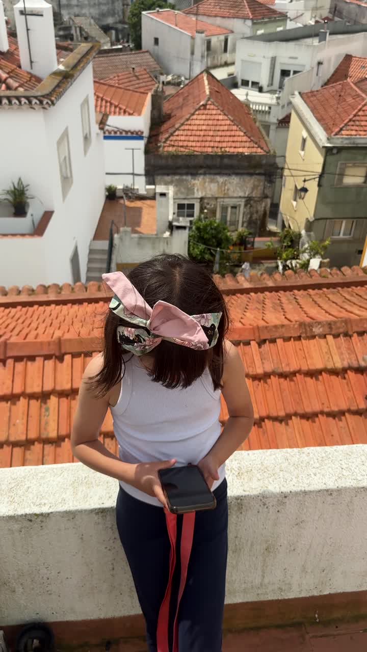 Girl on Rooftop with Smartphone