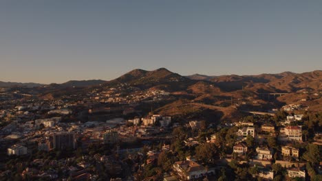 aerial forward moving drone shot over el candado hills in malaga spain