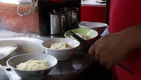 preparing chicken noodles