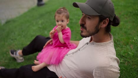 a father and daughter enjoying a day in the park