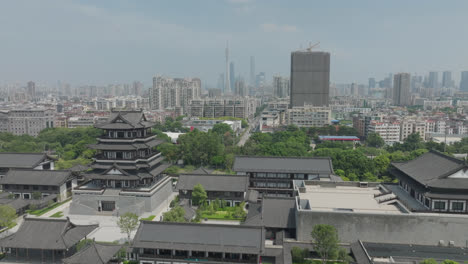 eastern chinese heritage town with buildings and a city in the distance