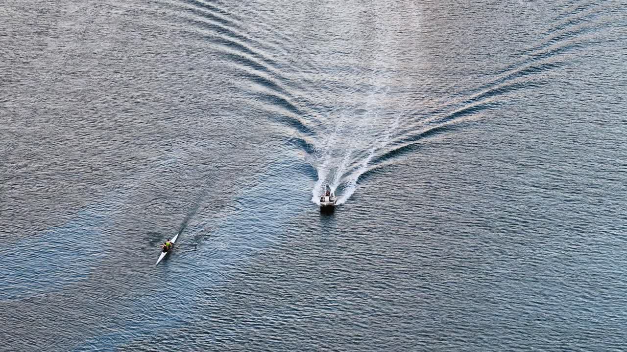 Drone footage captures rowing and jetski training on calm waters at Surfers Paradise, Gold Coast, Australia
