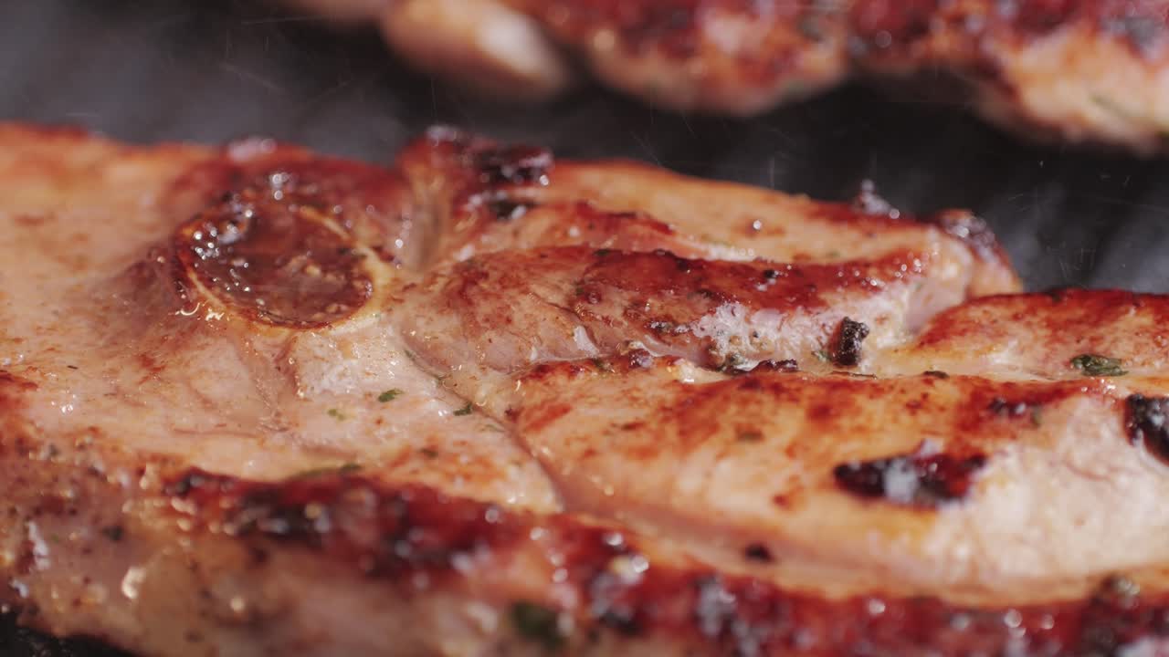 Cooking raw turkey meat in spices with garlic and greens on grill close-up. Fry chicken or turkey slice on frying pan Grilled chicken, duck, turkey kebab with vegetables.