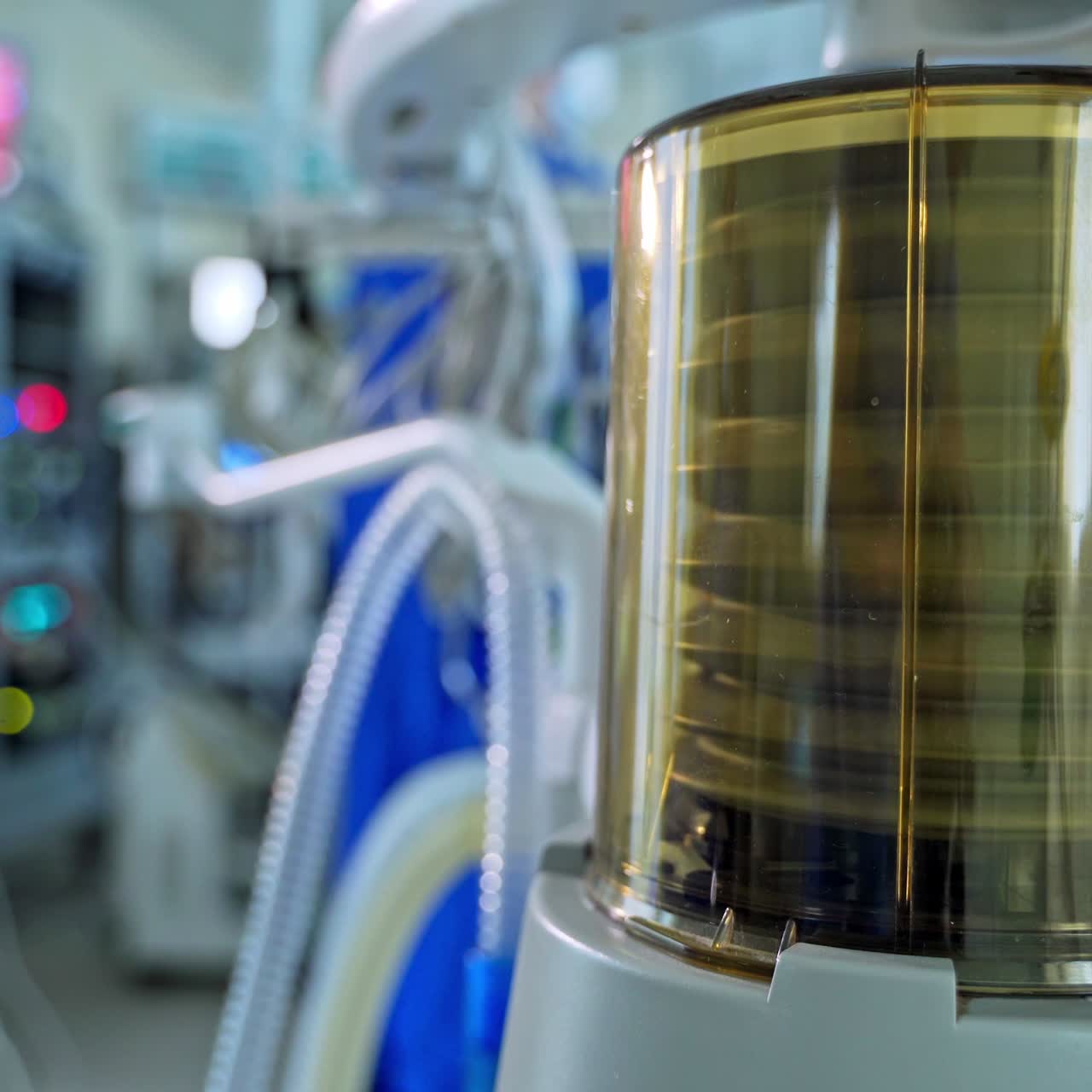 Medical device for lung ventilation. Movement of artificial ventilation apparatus on the blur background of intensive care unit. Close-up.