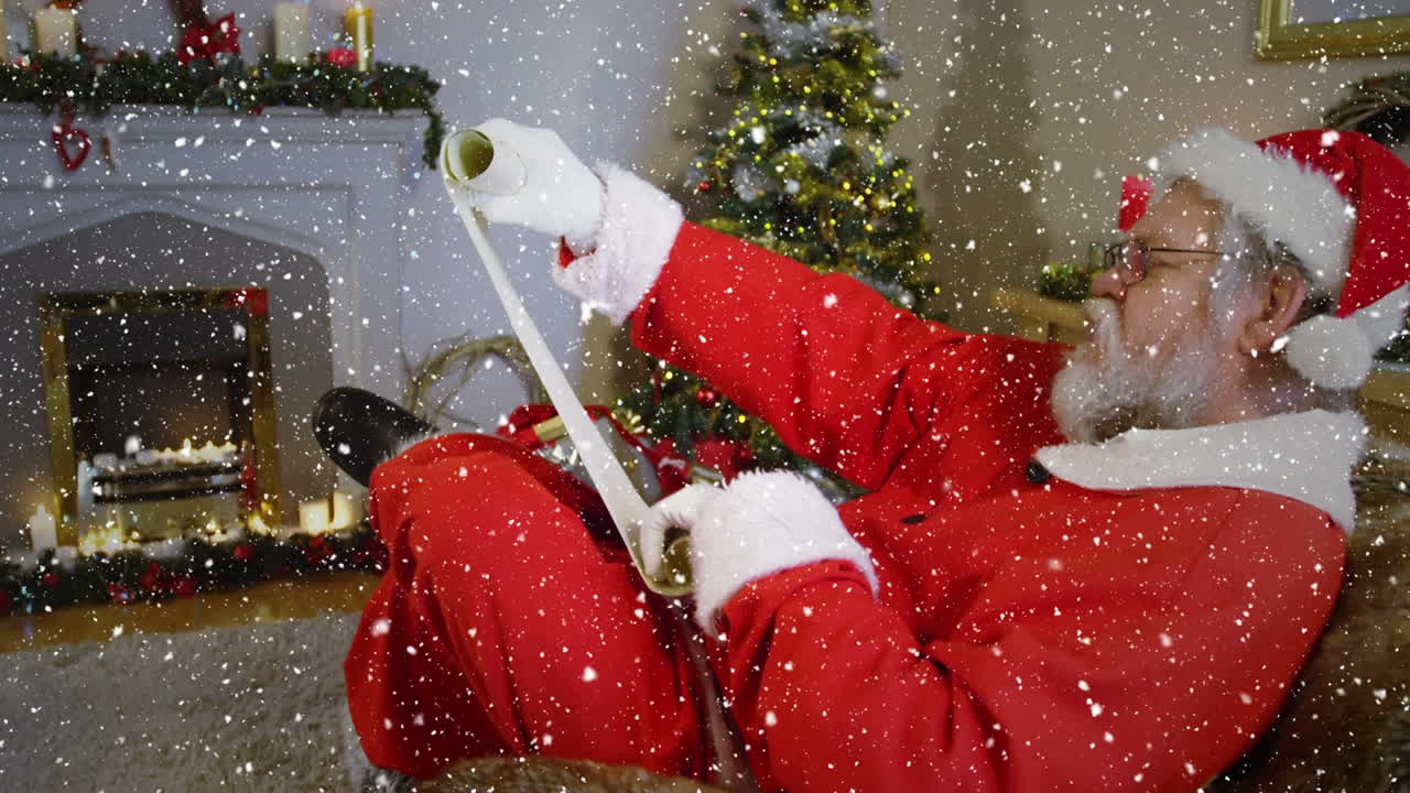 바람직한 목록을 보고 있는 산타 위에 눈이 내리는 비디오 작곡