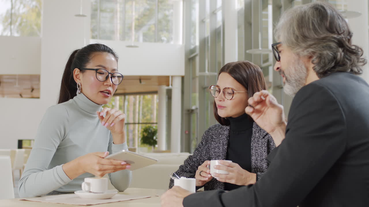 Business Partners Chatting At Restaurant