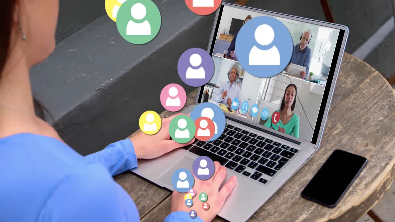 Animation of multicolored profile icons over diverse coworkers discussing on video call