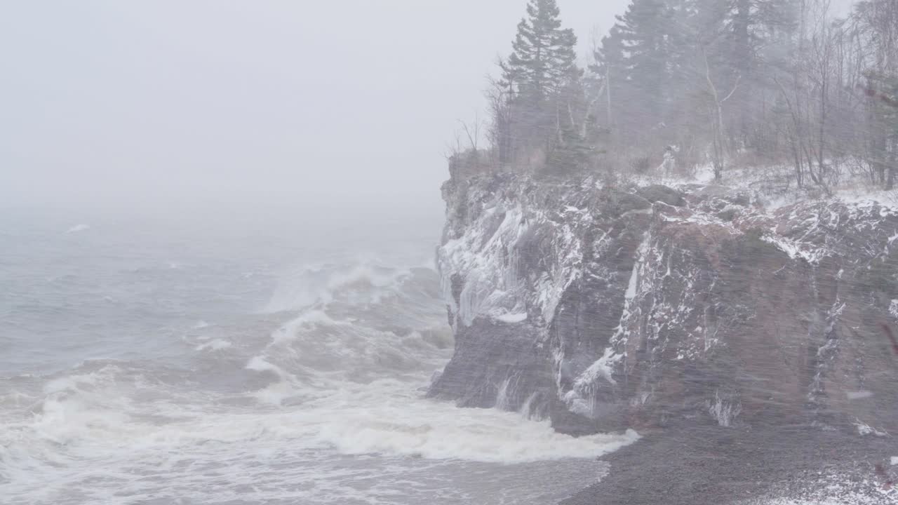 Roaring Winds And Crashing Waves On Lake Superior Shoreline. Winter Storm At Tettegouche State Park In Silver Bay, Minnesota. wide shot
