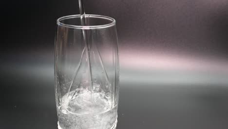 pouring mineral water into a glass