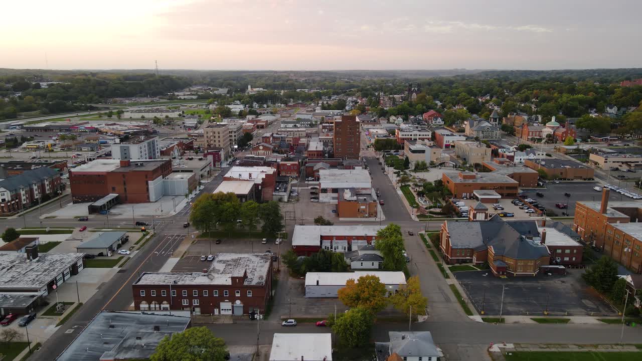 Aerial view of downtown Massillon, Ohio at sunset featuring historic buildings and streets. Crane Up Right Sunset N