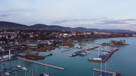 aerial sunset view over balatonfured harbor and surrounding marina under cloudy sky