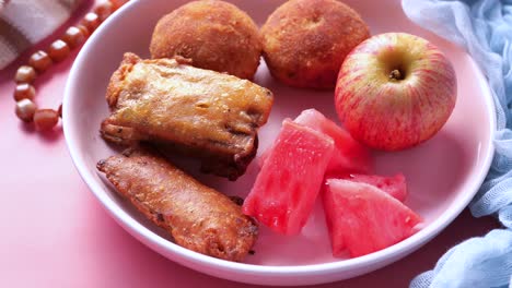 plate of assorted fried food and fruit