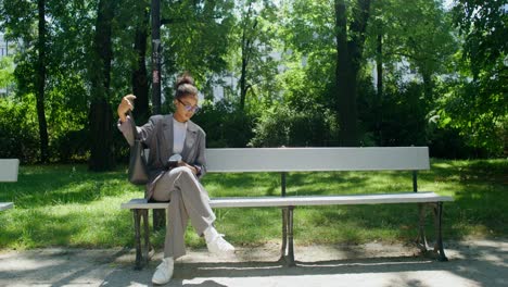 businesswoman relaxing in park