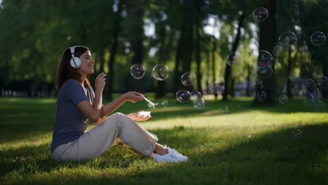 woman blowing bubbles in the park
