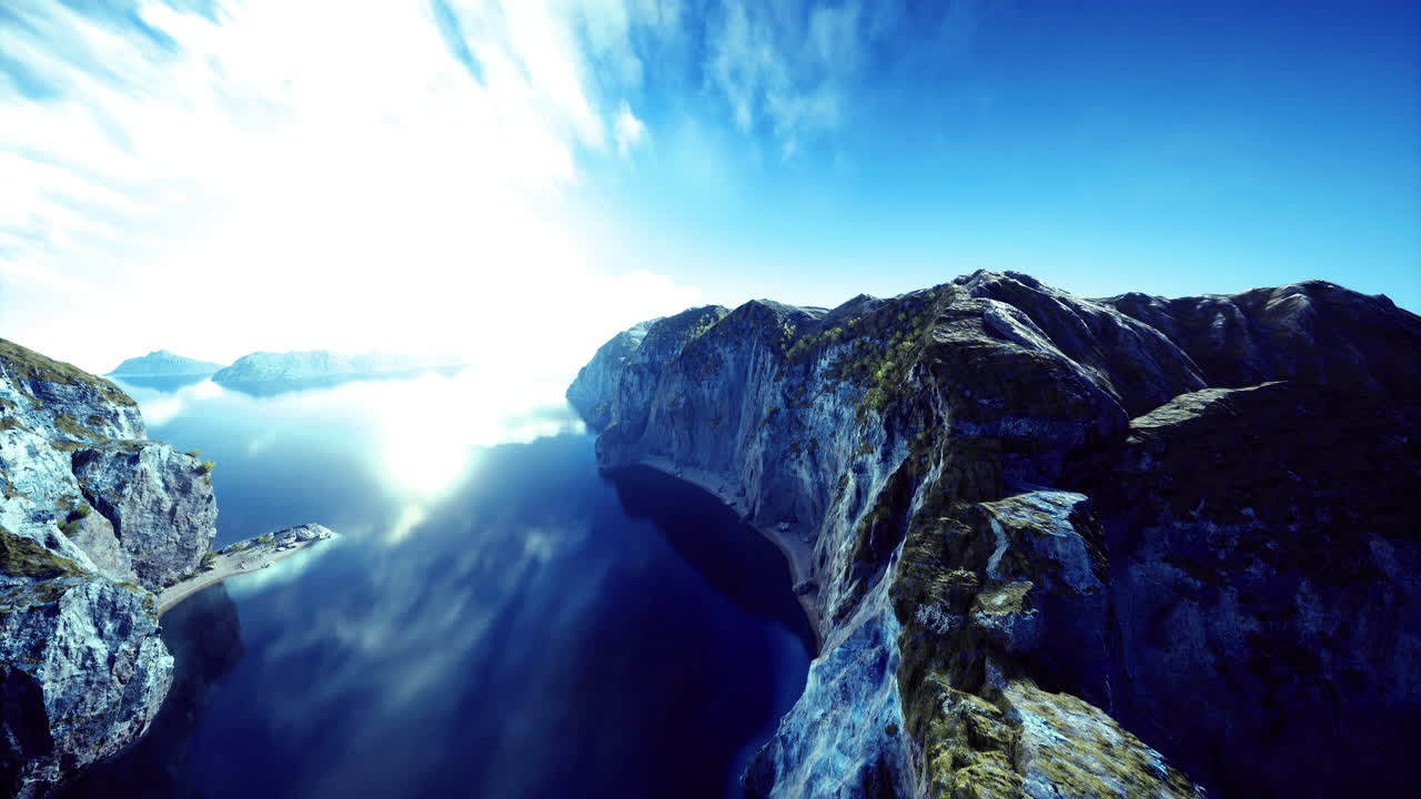 Majestic landscape view of cliffs reflecting in still waters on a bright day
