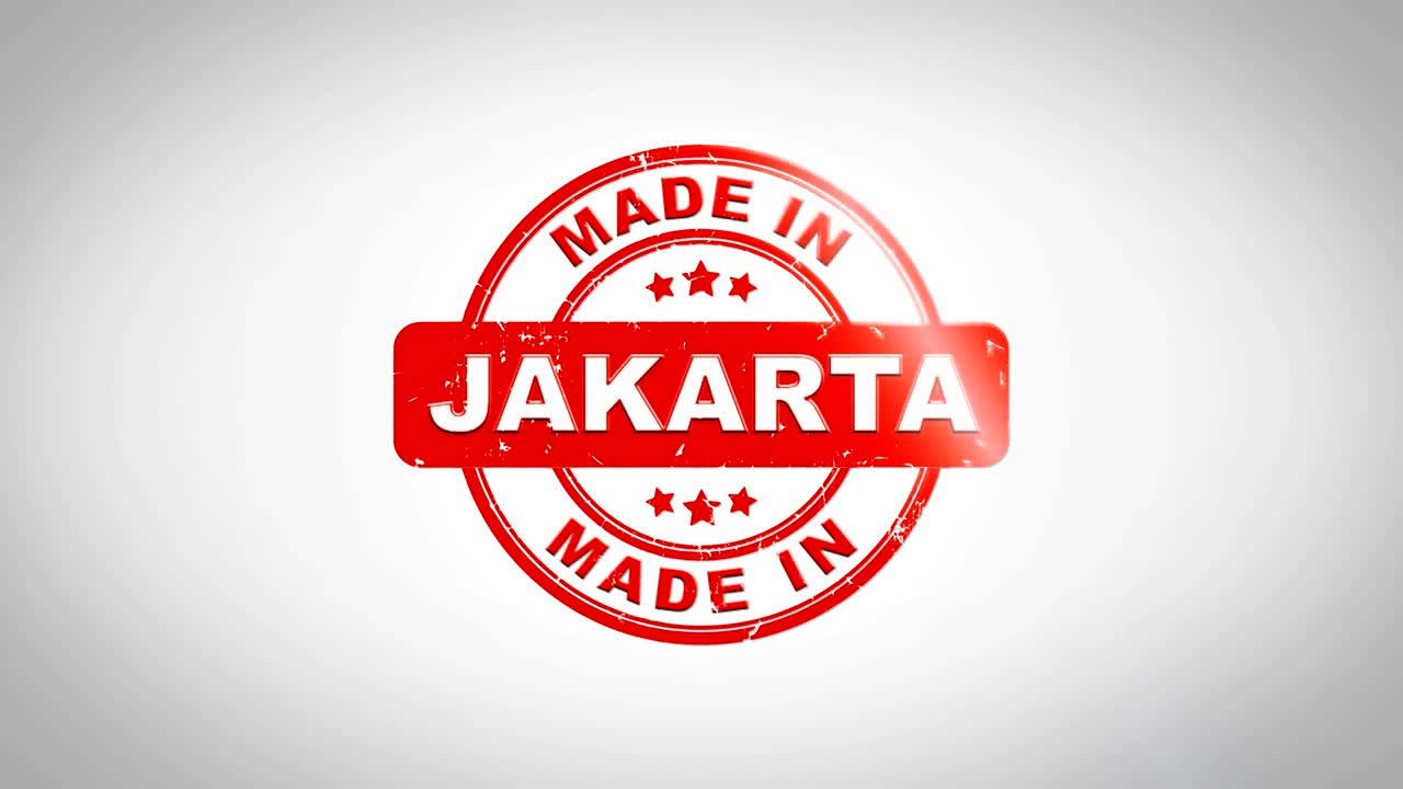 Fatto a JAKARTA Animazione di timbro in legno con testo timbrato. Inchiostro rosso su sfondo di carta bianca pulita con sfondo opaco verde incluso