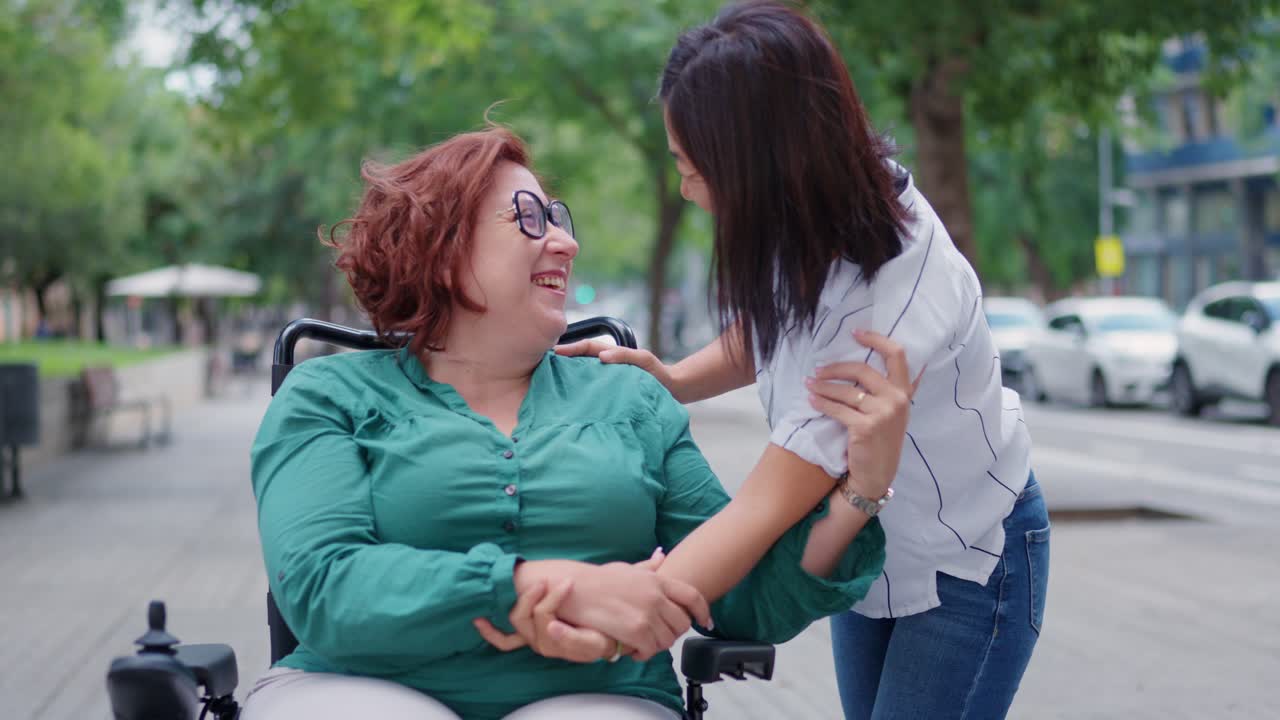 Two women sharing a friendly moment outdoors