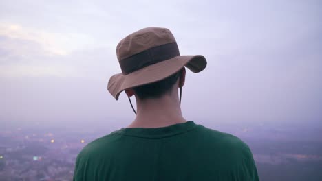 the camera films a man from behind