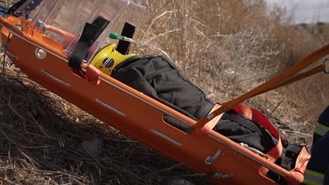 firefighter training exercise, moving injured person on stretcher