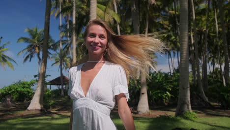 woman in a white dress at a tropical beach