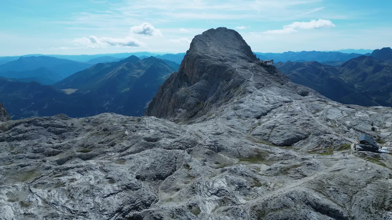 Drone footage of the Pale di San Martino in the Dolomites, Italy: majestic peaks, rocky spires, alpine meadows, and dramatic landscapes ideal for travel, nature, and adventure projects