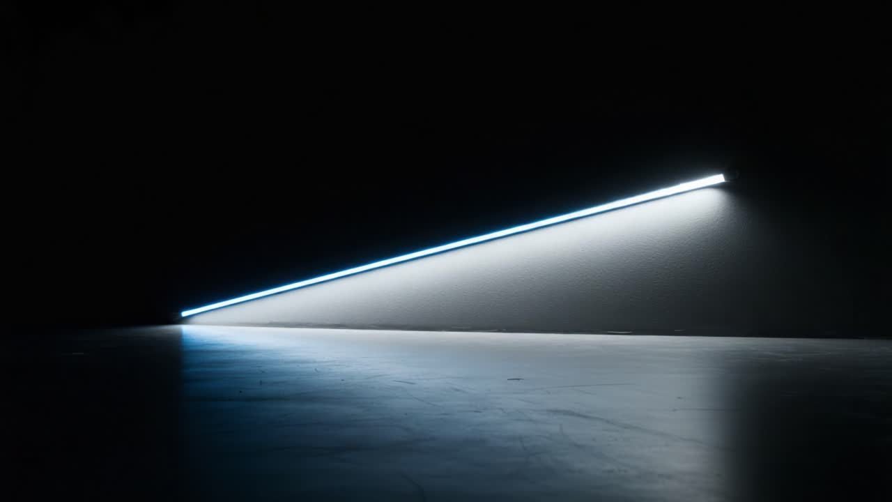 A Striking Contrast: The Elegant Interaction of Light and Shadow Captured in Two Stages with a Brilliant Blue Neon Line on a Dark Surface