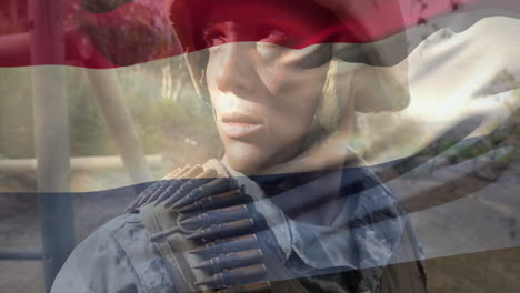 animation of flag of netherlands over caucasian male soldier wearing uniform