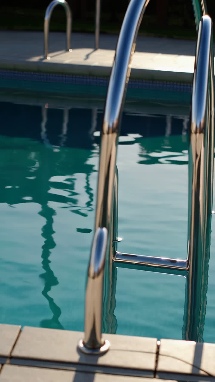 Pool Ladder and Water Reflection