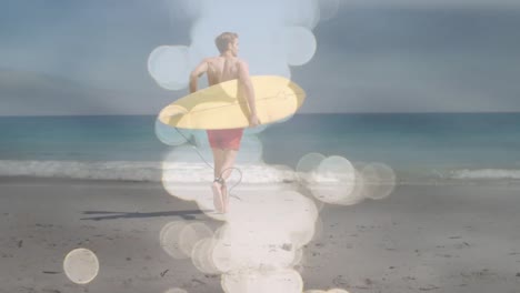 animation of water reflection over back view of caucasian male surfer running into sea