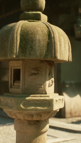 ancient stone lantern in a japanese garden